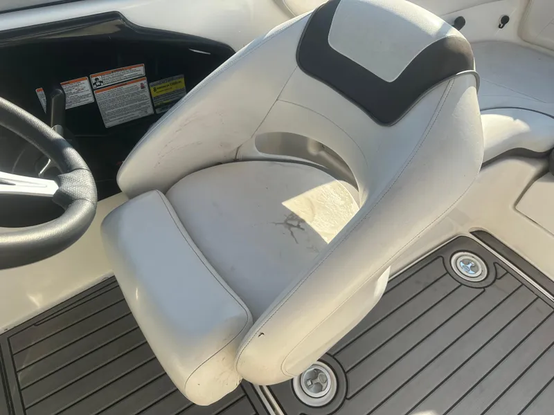 Slide: The Image of 2013 Yamaha Boats SX192 captain's chair with sleek design and comfortable seating. - 28