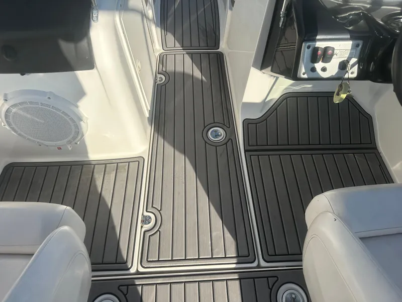 Slide: The Image of 2013 Yamaha SX192 boat interior with sleek, modern flooring and seating. - 34