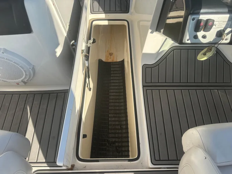 Slide: The Image of 2013 Yamaha SX192 boat interior storage compartment with non-slip flooring. - 35