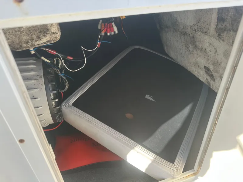 Slide: The Image of 2013 Yamaha SX192 boat storage compartment with wiring and equipment. - 36