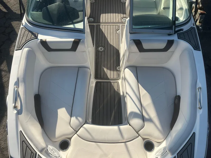 Slide: The Image of 2013 Yamaha Boats SX192 interior with white seating and sleek design. - 38