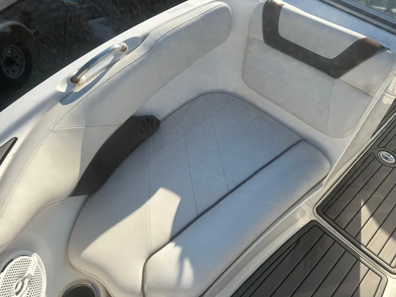 Slide: The Image of 2013 Yamaha Boats SX192 interior seating with white and black upholstery. - 41