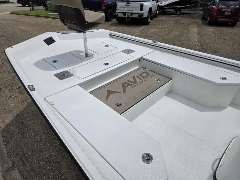 Slide: The Image of 2025 Avid 22 Recon boat deck with seating and storage compartments. - 10