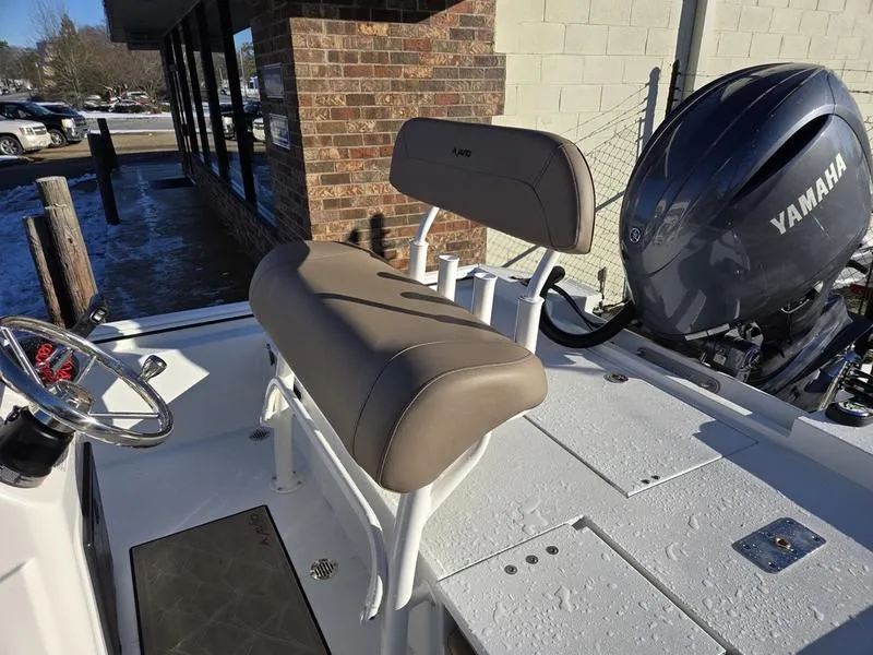 Slide: The Image of Avid 22 Recon boat interior with Yamaha engine, featuring a beige seat and steering wheel. - 6