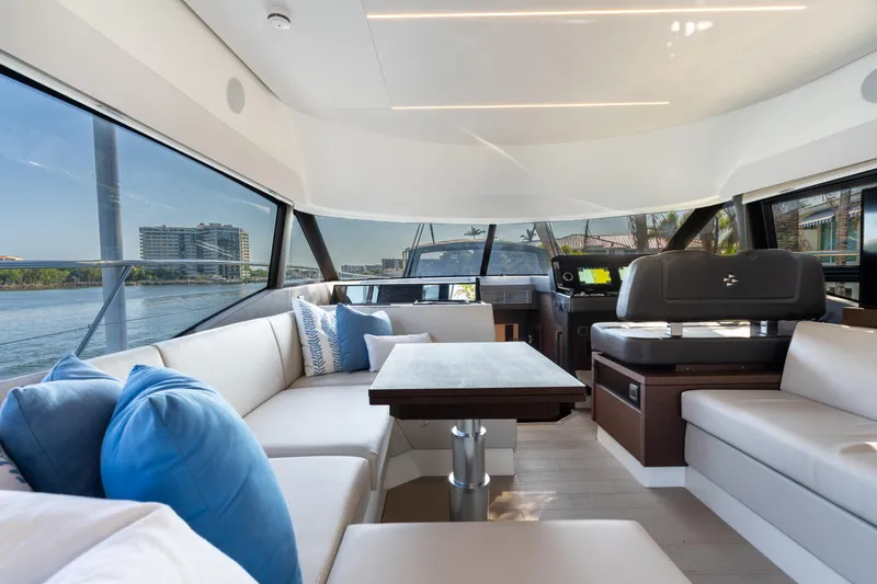 Slide: The Image of Luxurious interior of 2023 Prestige 460 Fly yacht with elegant seating and scenic views. - 18