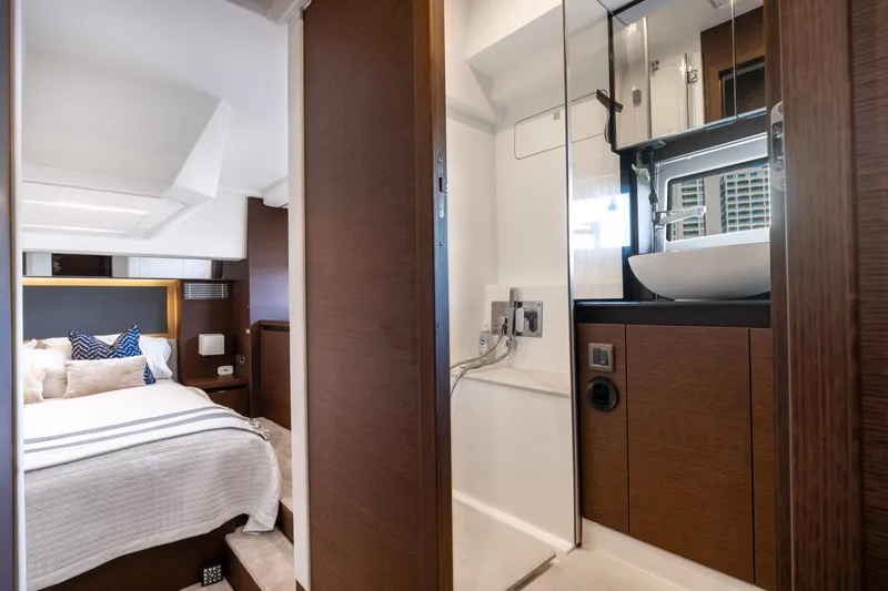Slide: The Image of Luxurious interior of 2023 Prestige 460 Fly yacht, featuring a modern bedroom and bathroom. - 26