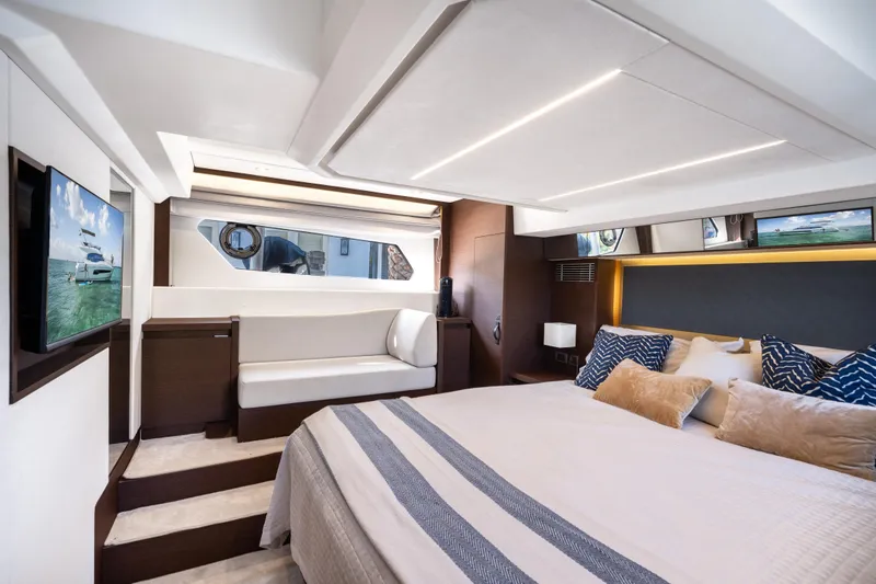 Slide: The Image of Luxurious interior of 2023 Prestige 460 Fly yacht with elegant bedroom and seating area. - 27
