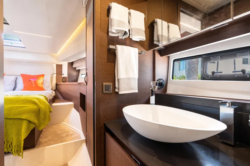 Slide: The Image of Luxurious interior of 2023 Prestige 460 Fly yacht, featuring modern bathroom and cozy bedroom. - 33
