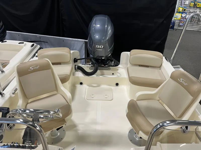Slide: The Image of 2025 Scout 175 Sport Dorado boat interior with seating and outboard motor. - 10