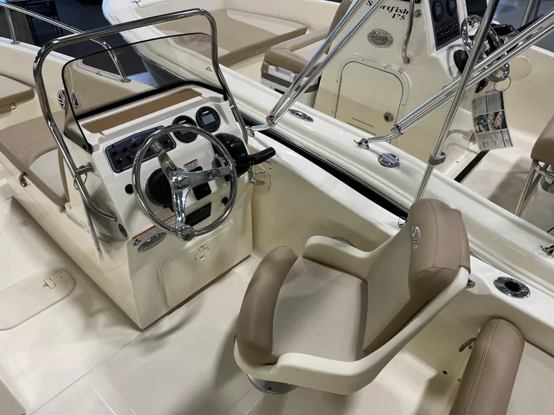 Slide: The Image of 2025 Scout 175 Sport Dorado boat interior with steering wheel and seating. - 4