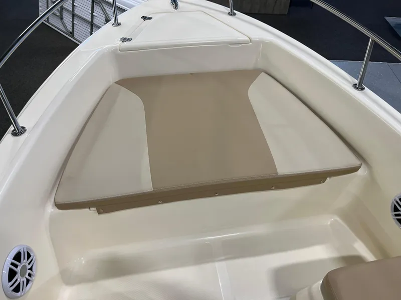 Slide: The Image of 2025 Scout 175 Sport Dorado boat interior with beige seating and stainless steel railings. - 8