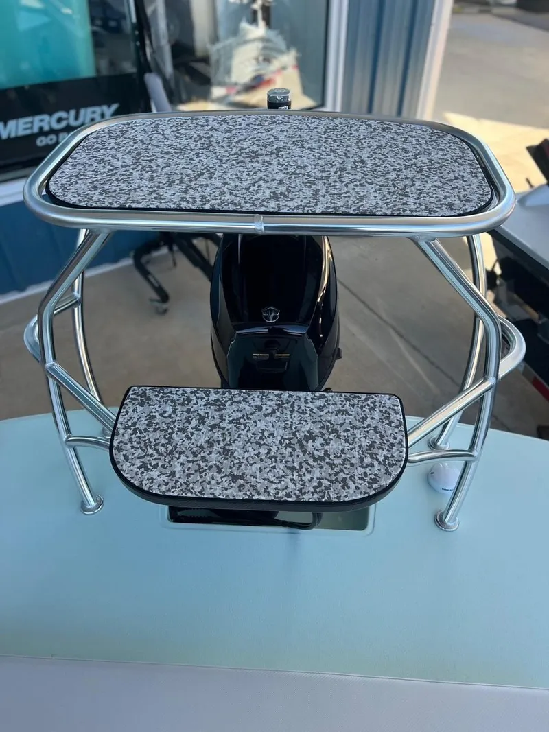 Slide: The Image of 2024 Chittum Skiffs Challenger 18 boat console with granite-patterned surfaces. - 12