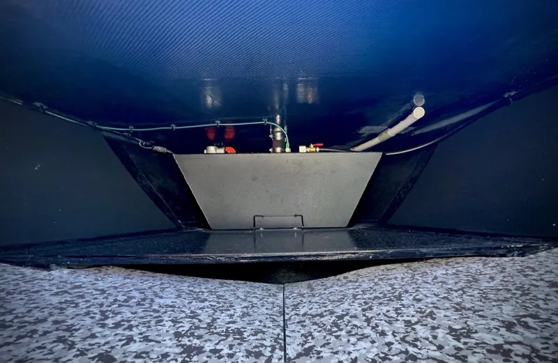 Slide: The Image of 2024 Chittum Skiffs Challenger 18 underdeck view, showcasing wiring and components. - 17