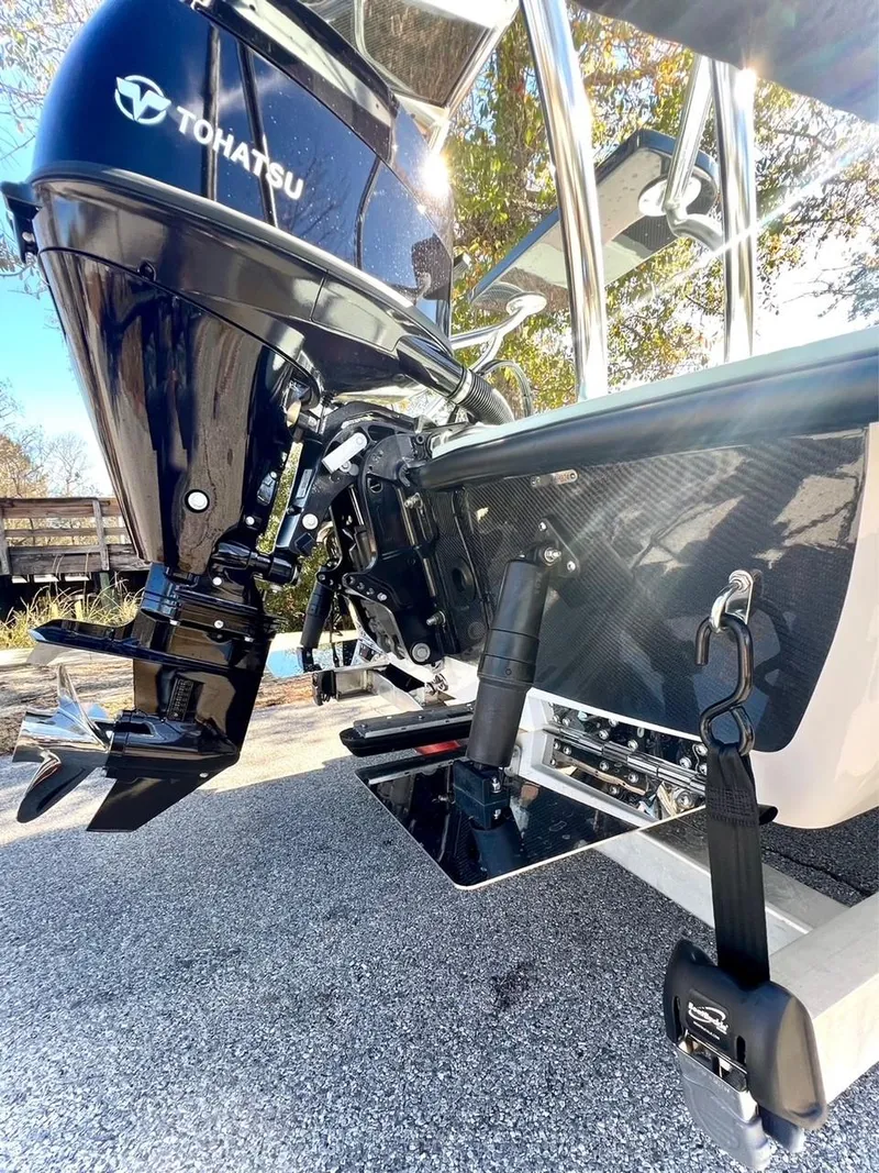 Slide: The Image of 2024 Chittum Skiffs Challenger 18 with Tohatsu outboard motor, rear view. - 5
