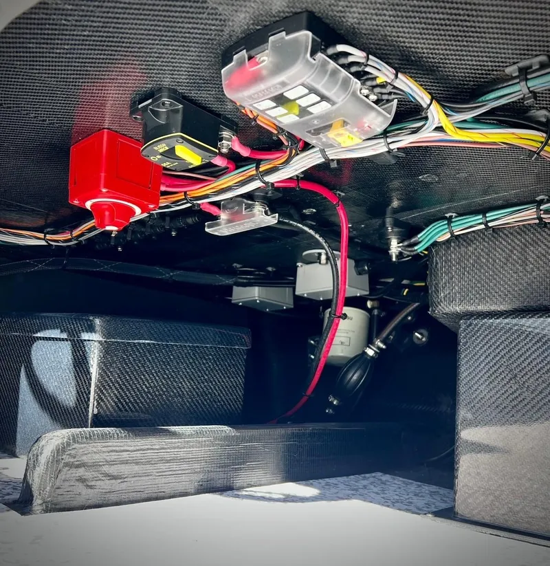 Slide: The Image of 2024 Chittum Skiffs Challenger 18 wiring and components under the deck. - 7