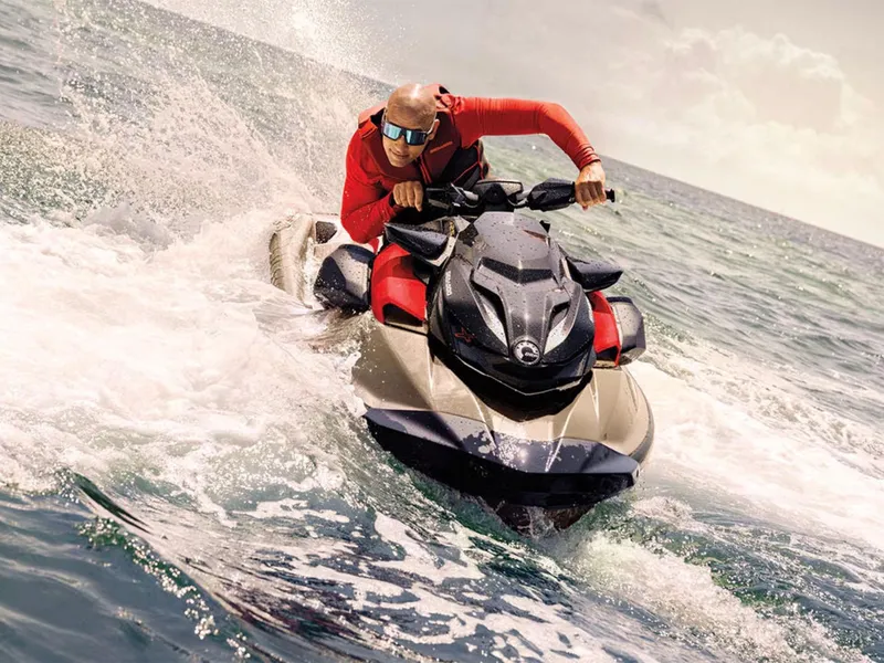 Slide: The Image of Man riding 2025 Sea-Doo RXP-X 325 Tech Package on ocean waves. - 9