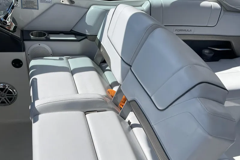 Slide: The Image of 2020 Formula 330 Crossover Bowrider interior with white leather seating and modern design. - 6