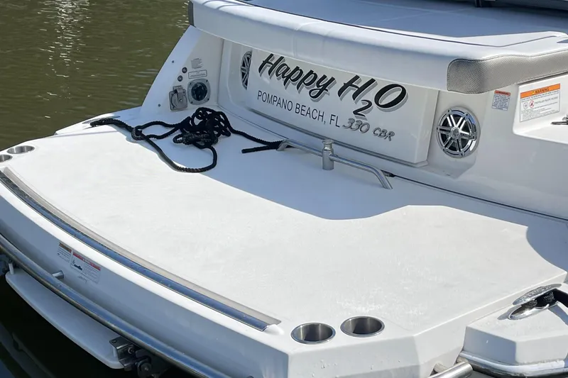 Slide: The Image of 2020 Formula 330 Crossover Bowrider boat, rear view, docked in Pompano Beach, FL. - 7