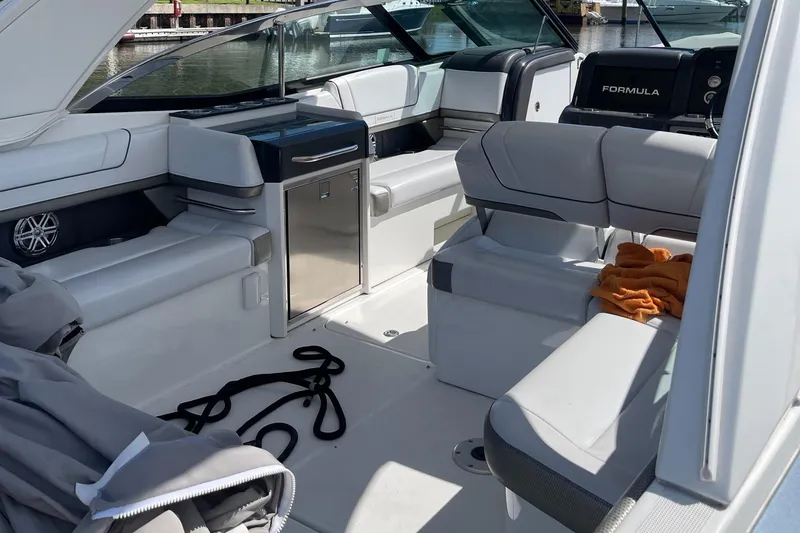 Slide: The Image of 2020 Formula 330 Crossover Bowrider interior with sleek seating and modern amenities. - 8