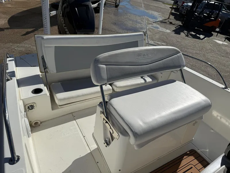 Slide: The Image of 2014 Boston Whaler 240 Dauntless boat seating area with cushioned seats. - 10