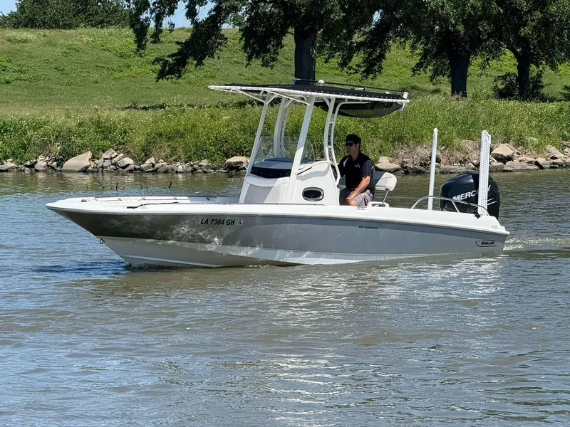 Slide: The Image of 2014 Boston Whaler 240 Dauntless boat cruising on a sunny day. - 20