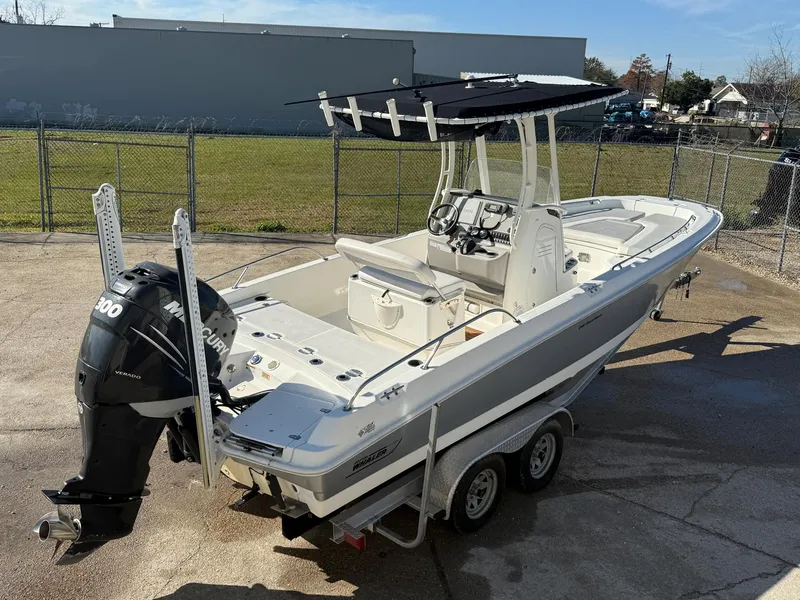 Slide: The Image of 2014 Boston Whaler 240 Dauntless boat on trailer with Mercury engine. - 3