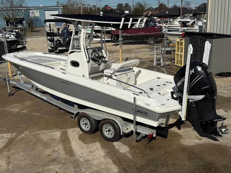 Slide: The Image of 2014 Boston Whaler 240 Dauntless boat on trailer with Mercury outboard engine. - 7