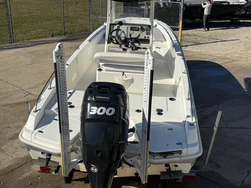 Slide: The Image of 2014 Boston Whaler 240 Dauntless boat with 300 Verado engine, parked outdoors. - 8