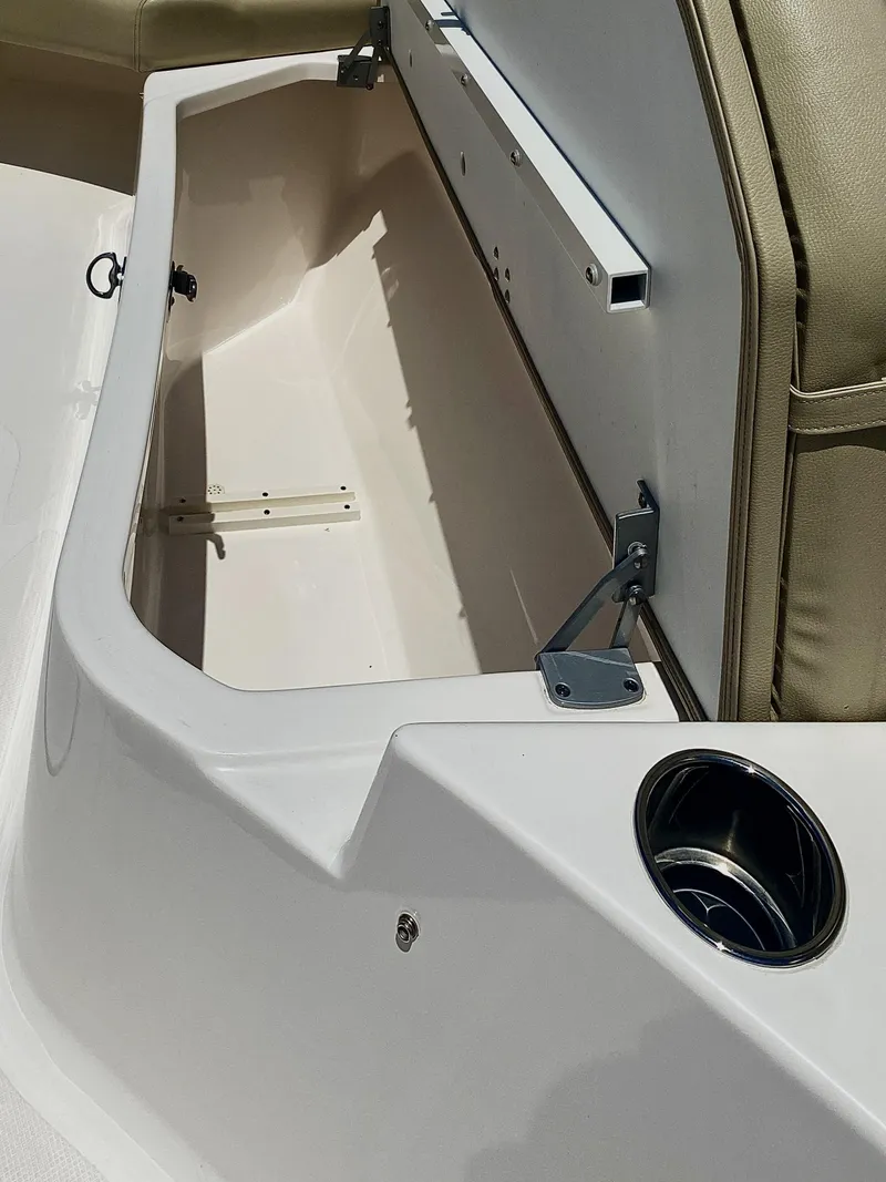 Slide: The Image of 2019 Pursuit S 408 Sport boat storage compartment with open lid. - 10