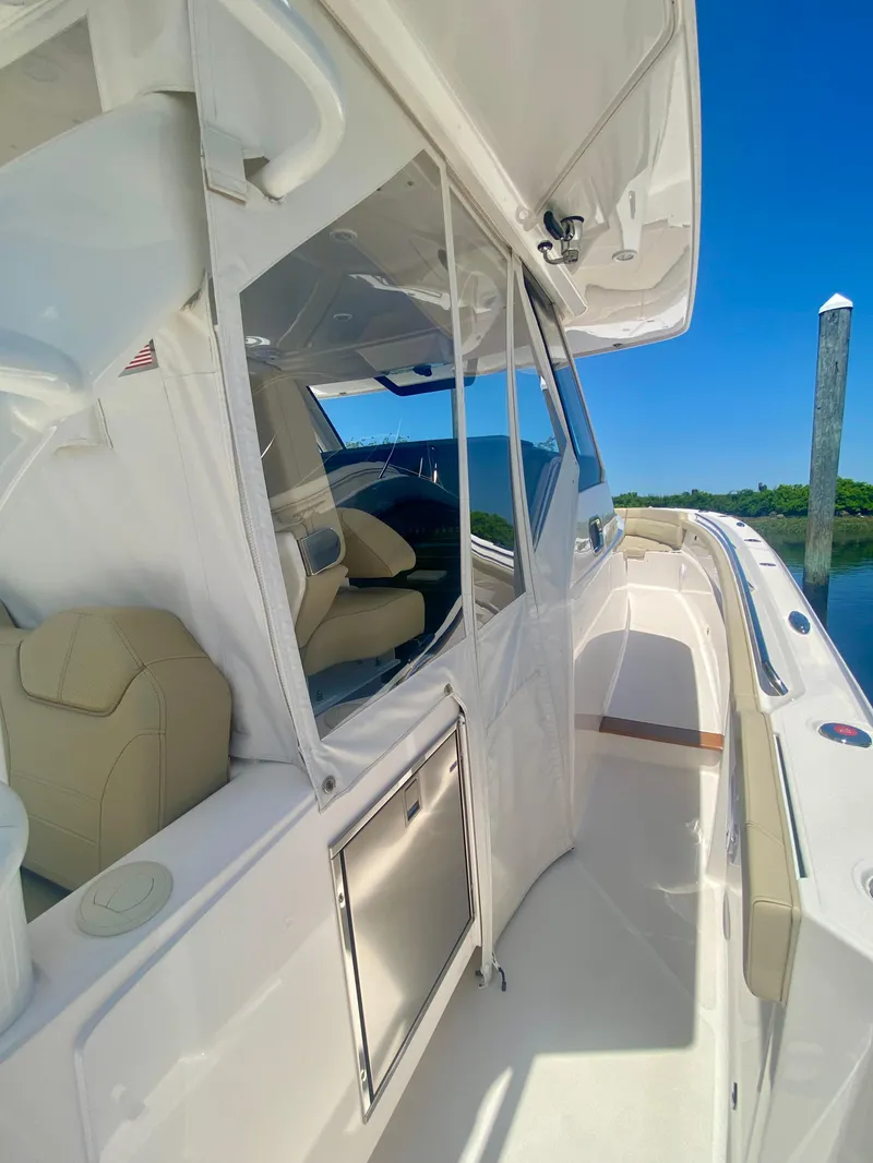 Slide: The Image of 2019 Pursuit S 408 Sport boat with sleek design and luxurious interior. - 17