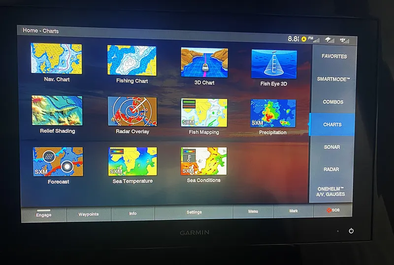 Slide: The Image of Garmin marine navigation display on 2019 Pursuit S 408 Sport, showing various chart options. - 24