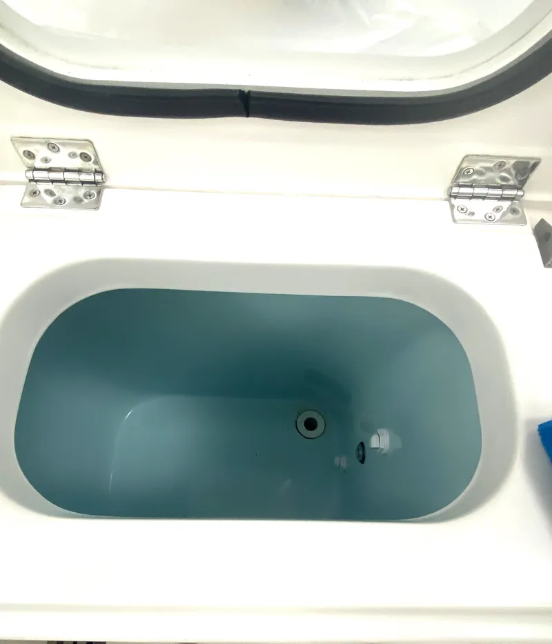 Slide: The Image of 2019 Pursuit S 408 Sport boat livewell with open lid and stainless steel hinges. - 35