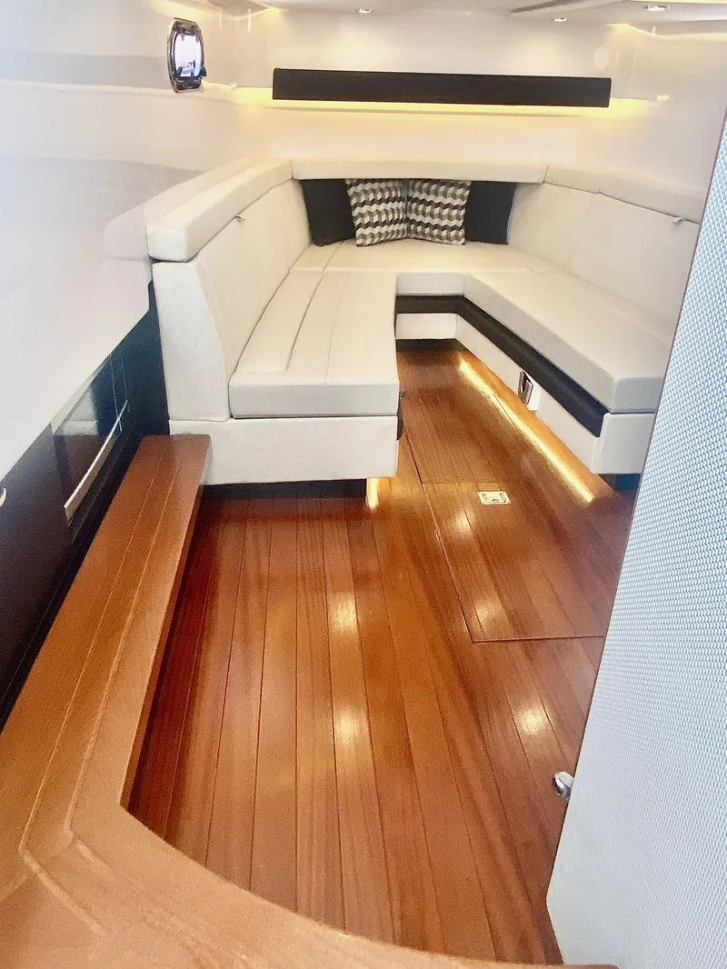 Slide: The Image of 2019 Pursuit S 408 Sport interior with wooden flooring and cushioned seating. - 36