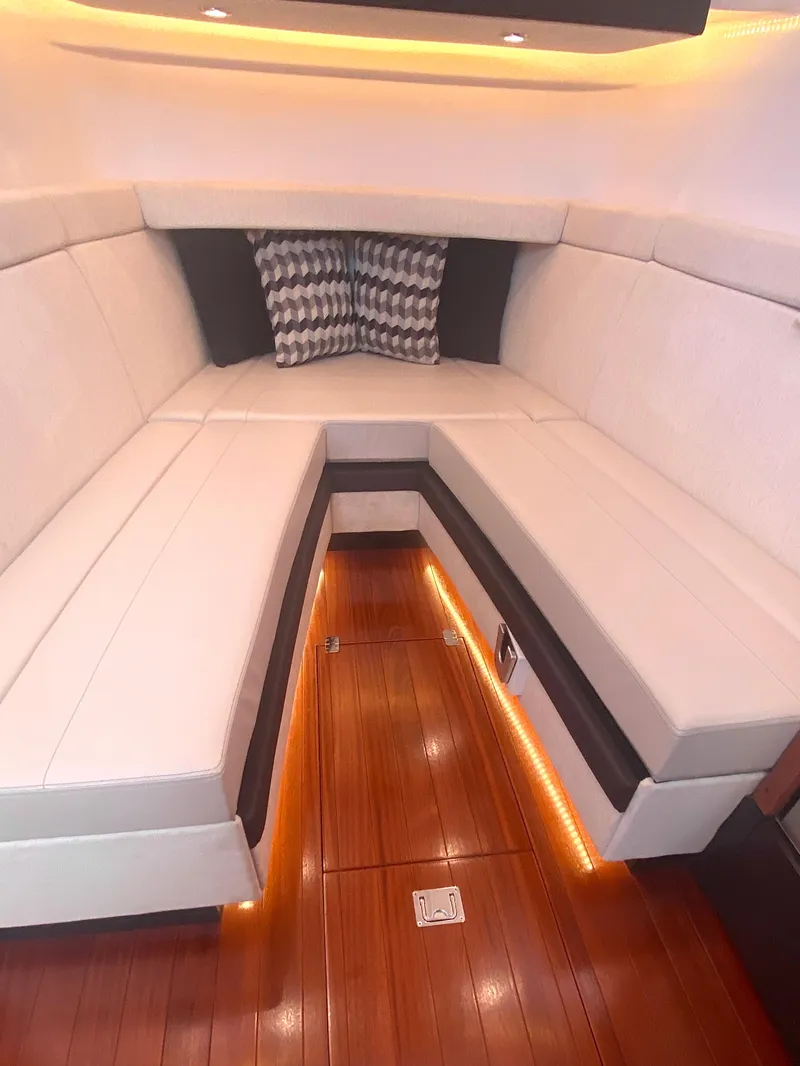 Slide: The Image of Luxurious interior of 2019 Pursuit S 408 Sport boat with elegant seating and ambient lighting. - 37