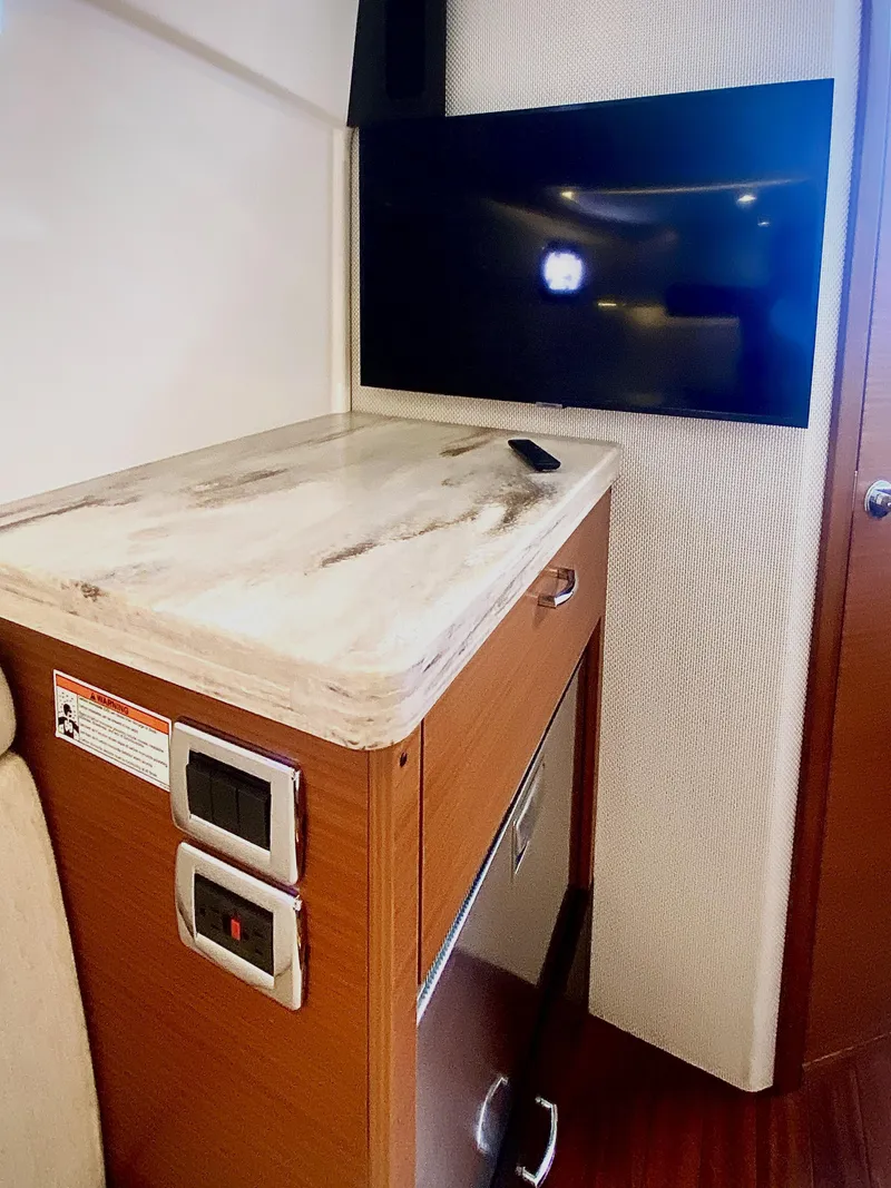 Slide: The Image of 2019 Pursuit S 408 Sport interior with TV and countertop. - 40