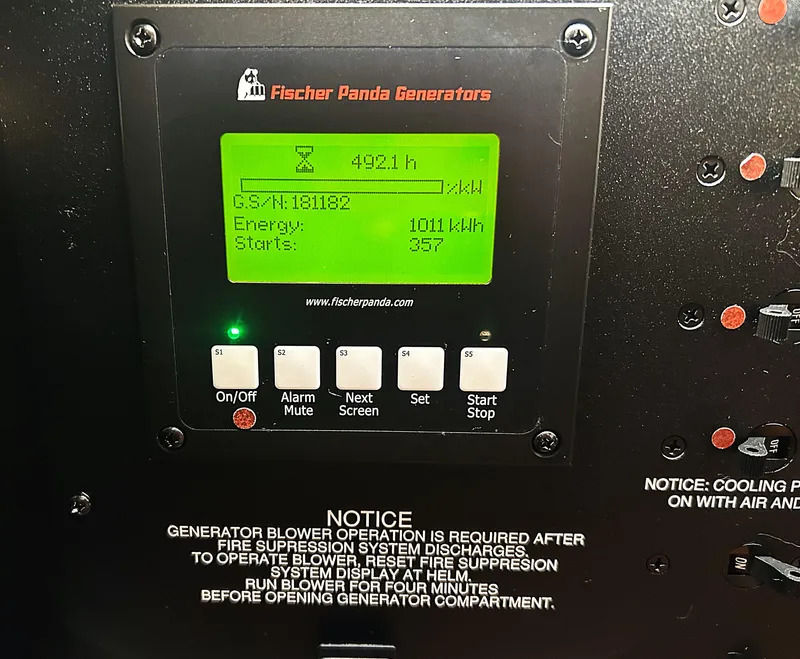 Slide: The Image of Fischer Panda generator display showing 492.1 hours, 1011 kWh energy, and 357 starts. - 43