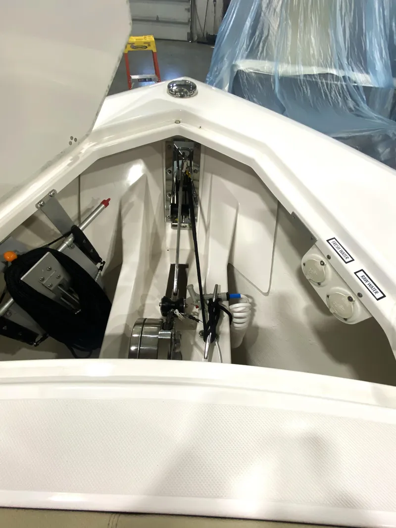 Slide: The Image of 2019 Pursuit S 408 Sport boat interior showing anchor storage and equipment. - 6