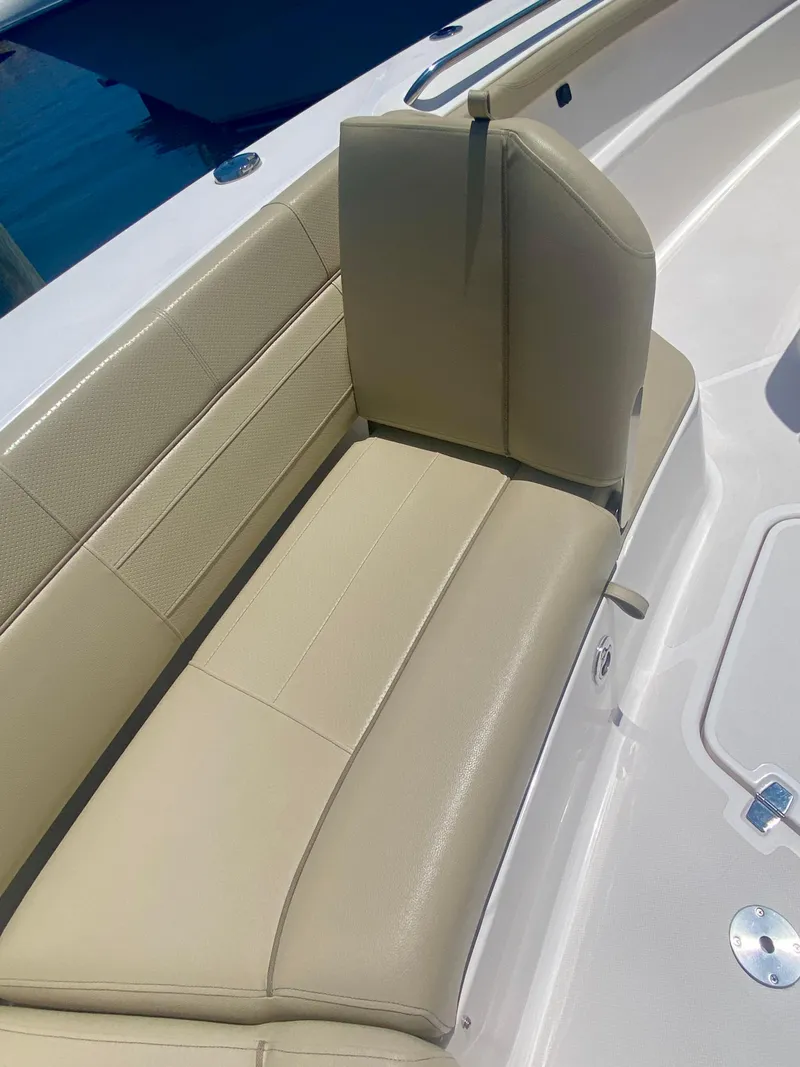 Slide: The Image of 2019 Pursuit S 408 Sport boat with beige leather seating. - 9