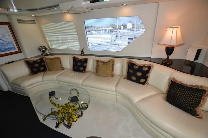 Slide: The Image of Luxurious interior of 1996 Hatteras 82 Convertible yacht with elegant seating and decor. - 14