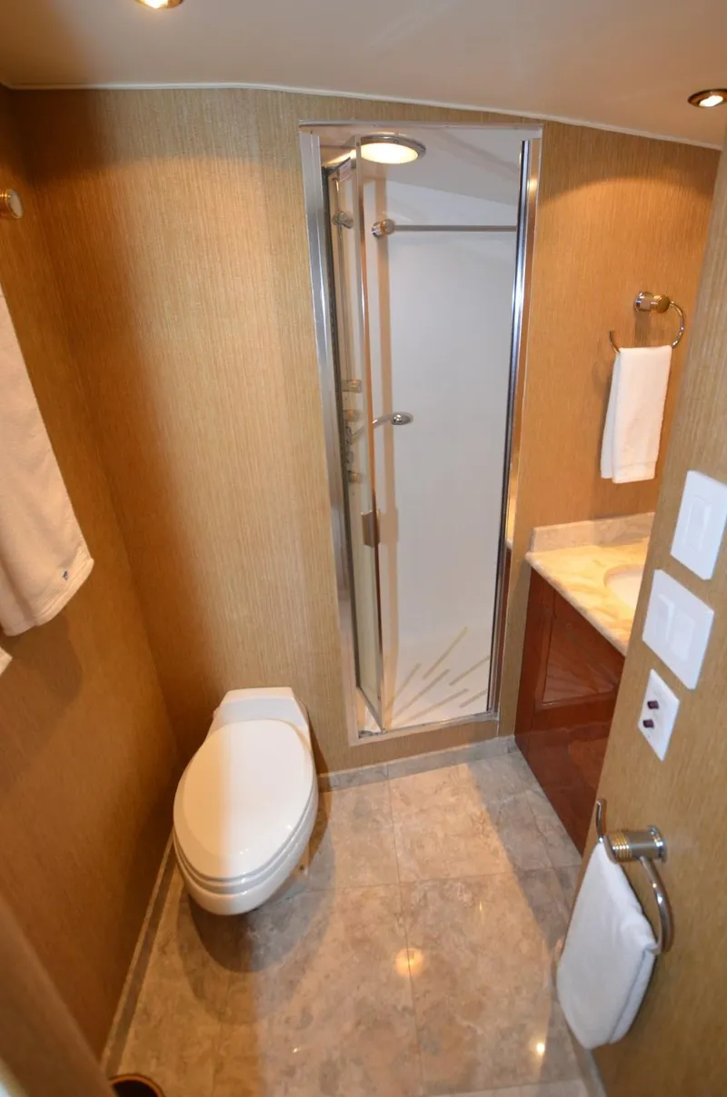 Slide: The Image of Luxurious bathroom in 1996 Hatteras 82 Convertible yacht with shower and modern fixtures. - 49