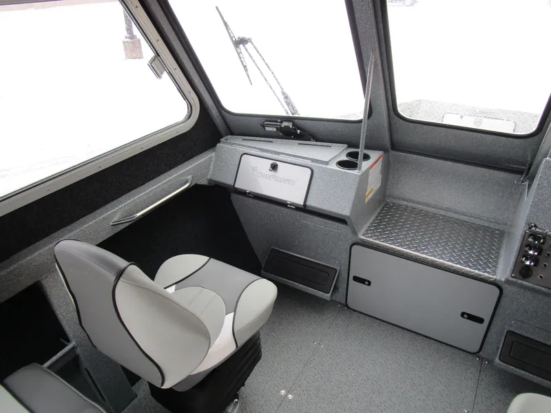 Slide: The Image of Interior of 2025 KingFisher Escape HT boat, featuring modern seating and dashboard. - 14