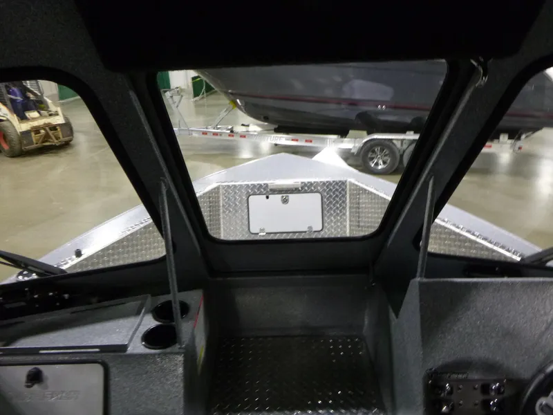 Slide: The Image of Interior view of 2025 KingFisher Escape HT boat, showcasing dashboard and windshield. - 16