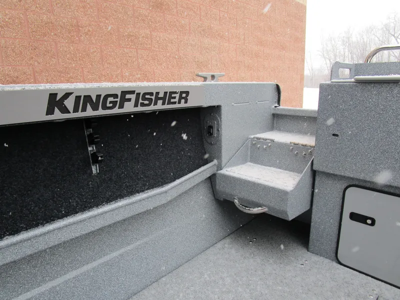 Slide: The Image of KingFisher 2025 Escape HT boat interior with steps and storage compartment. - 21