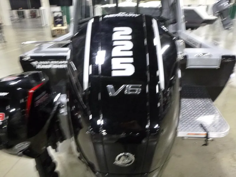 Slide: The Image of Outboard motor on a 2025 KingFisher Escape HT boat, featuring a V6 engine. - 24