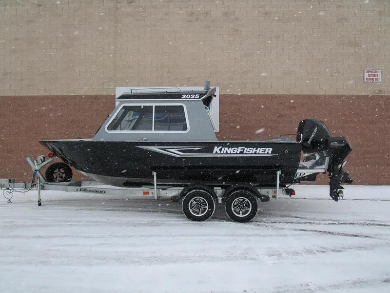 Slide: The Image of KingFisher 2025 Escape HT boat on trailer in snowy setting. - 26