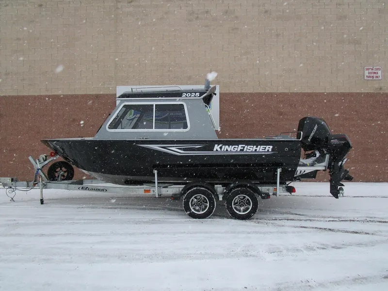 Slide: The Image of KingFisher 2025 Escape HT boat on trailer in snowy setting. - 27