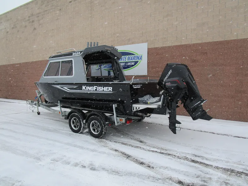Slide: The Image of KingFisher 2025 Escape HT boat on trailer in snowy setting. - 28
