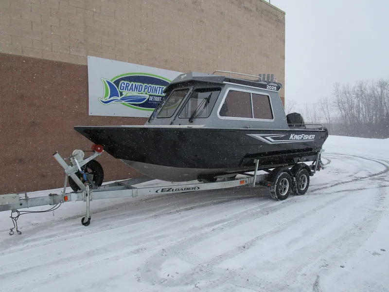 Slide: The Image of KingFisher 2025 Escape HT boat on trailer in snowy setting. - 31