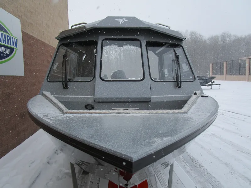Slide: The Image of KingFisher 2025 Escape HT boat in snowy outdoor setting, front view. - 32