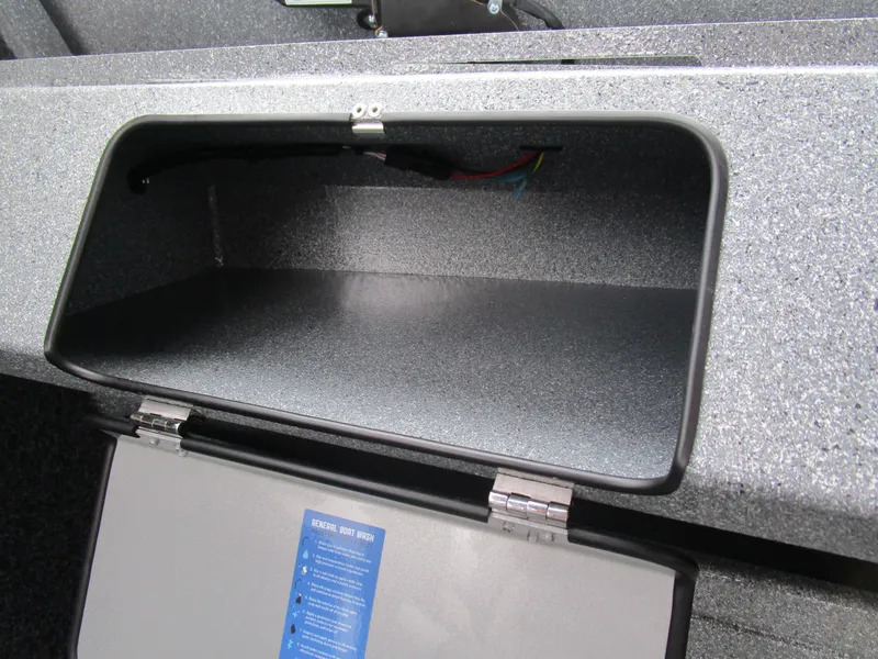 Slide: The Image of Open storage compartment in a 2025 KingFisher Escape HT boat. - 37